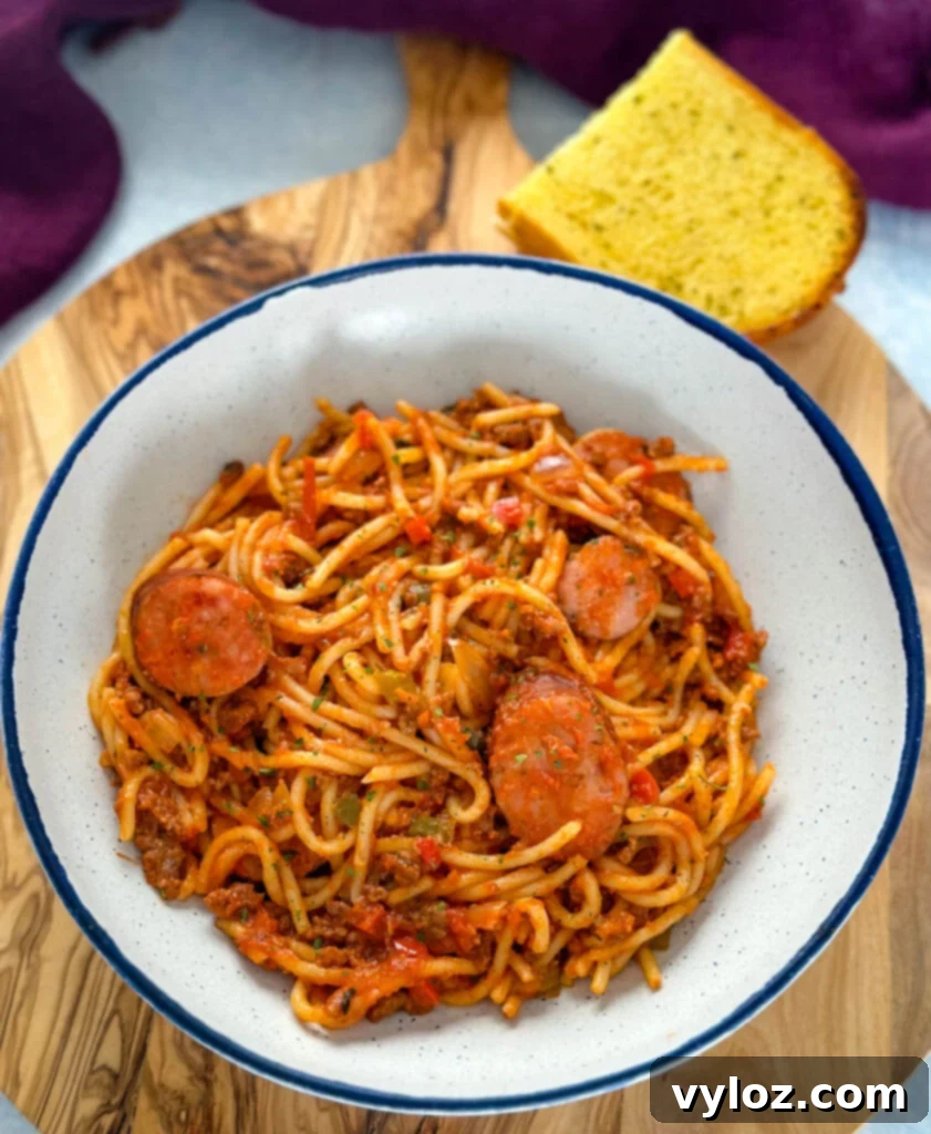 Ultimate Italian Sausage Spaghetti 2 beef and sausage spaghetti in a white bowl