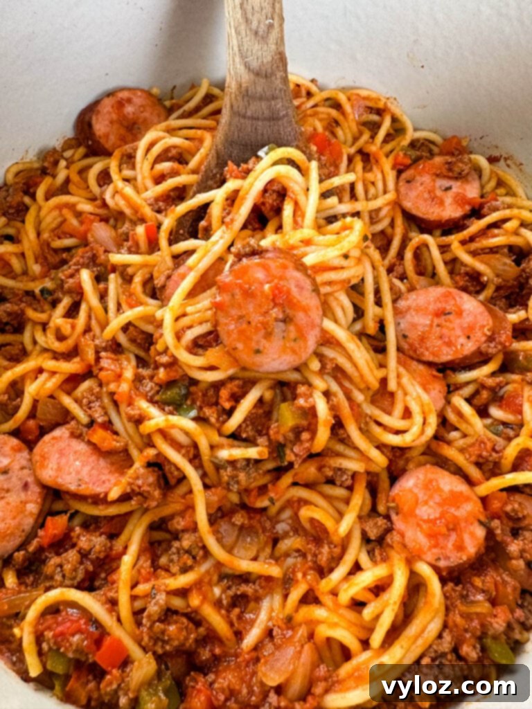 Ultimate Italian Sausage Spaghetti 11 beef and sausage spaghetti in a Dutch oven