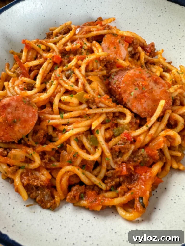 Ultimate Italian Sausage Spaghetti 12 beef and sausage spaghetti in a white bowl