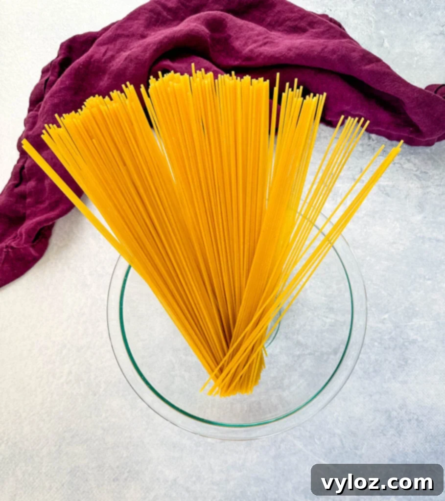 Ultimate Italian Sausage Spaghetti 4 dry spaghetti pasta in a glass bowl