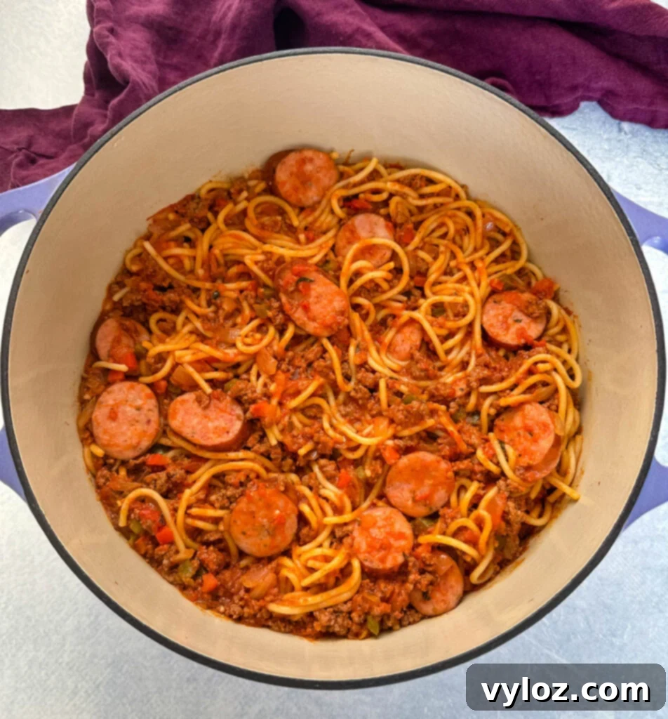 Ultimate Italian Sausage Spaghetti 10 beef and sausage spaghetti in a Dutch oven