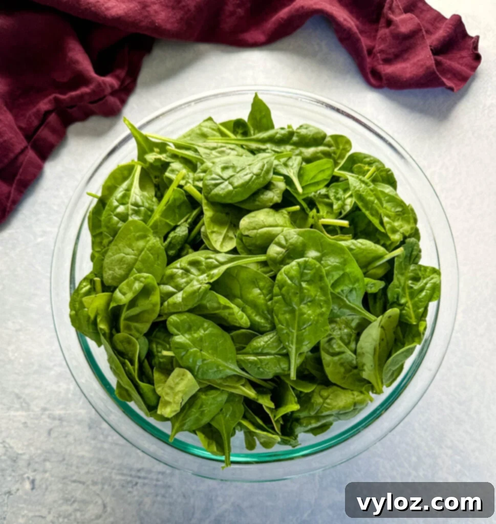 Classic Southern Creamed Spinach, Fresh or Frozen 3 fresh spinach in a glass bowl