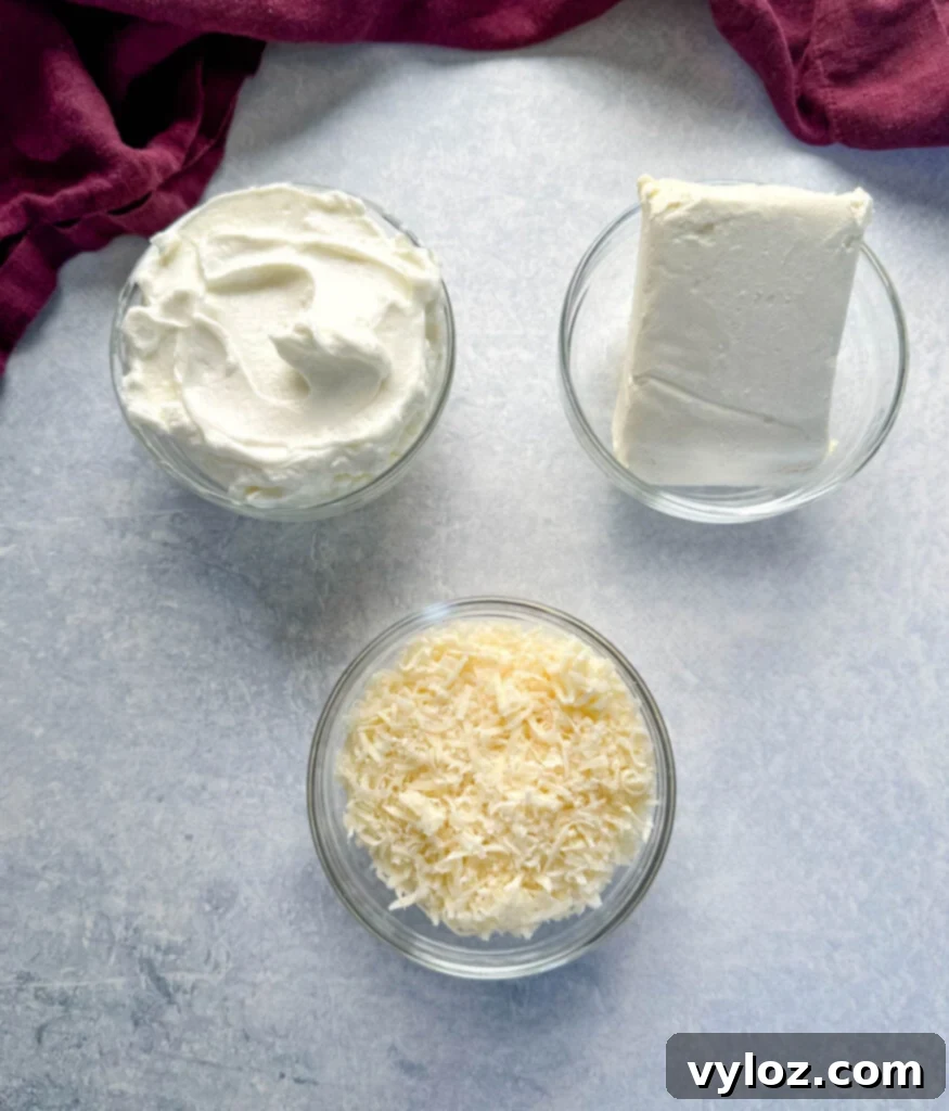 Classic Southern Creamed Spinach, Fresh or Frozen 5 Greek yogurt, cream cheese, and Parmesan cheese in separate glass bowls