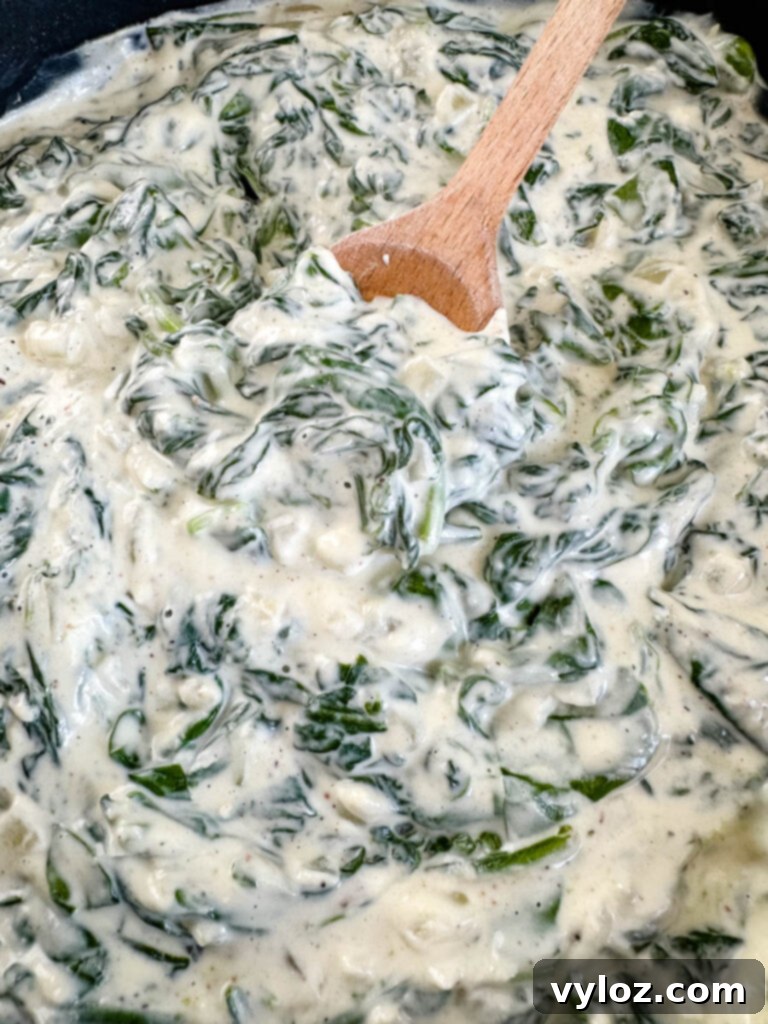 Classic Southern Creamed Spinach, Fresh or Frozen 9 steakhouse creamed spinach in a cast iron skillet
