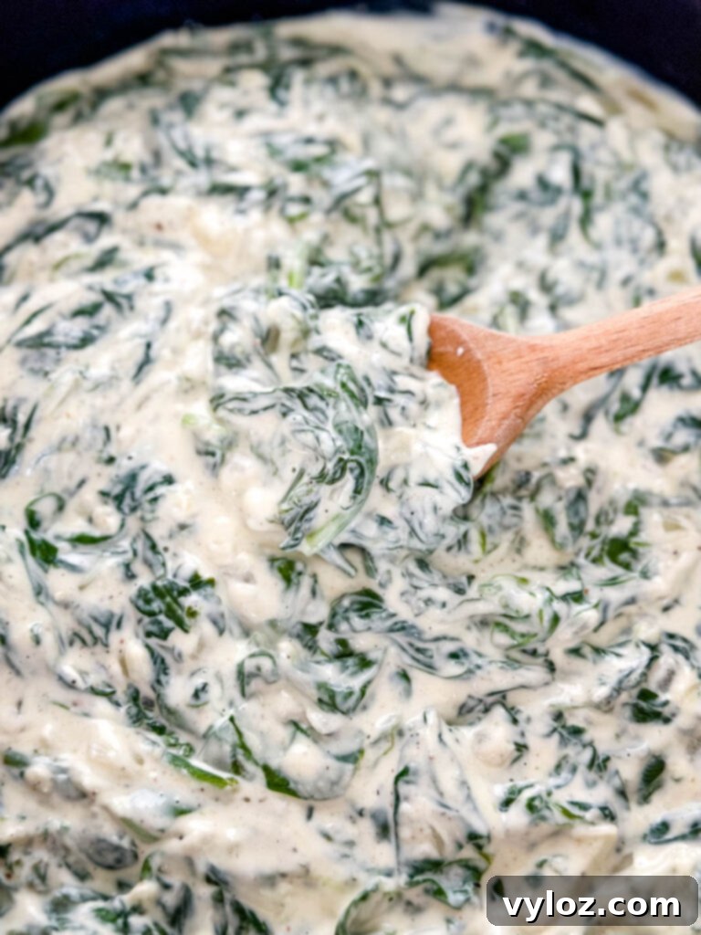 Classic Southern Creamed Spinach, Fresh or Frozen 10 steakhouse creamed spinach in a cast iron skillet