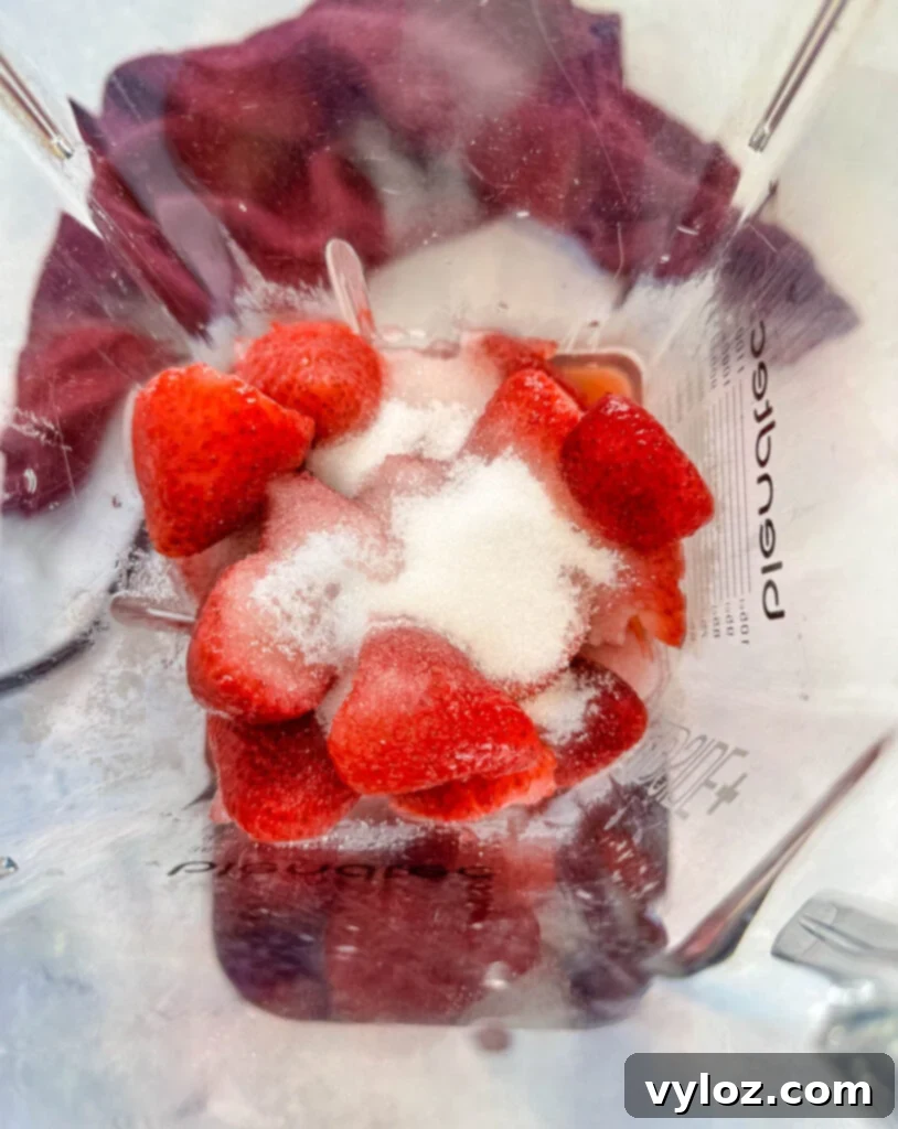 The Ultimate Hennessy Margarita 6 strawberries, sugar, and water in a blender