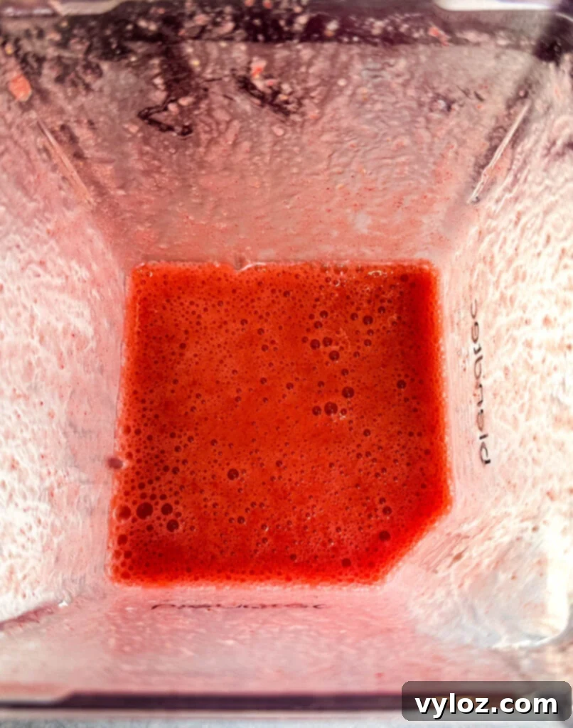 The Ultimate Hennessy Margarita 7 pureed strawberries in a blender