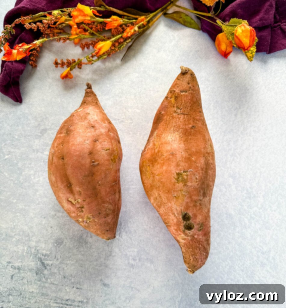 Sticky Sweet Slow Cooker Sweet Potatoes 3 raw sweet potatoes on a flat surface