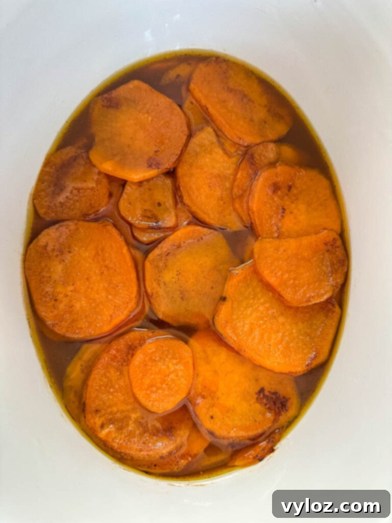 Sticky Sweet Slow Cooker Sweet Potatoes 7 candied sweet potatoes yams in a Crockpot slow cooker