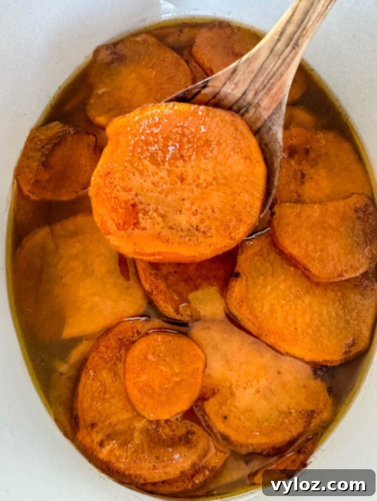 Sticky Sweet Slow Cooker Sweet Potatoes 8 candied sweet potatoes yams in a Crockpot slow cooker