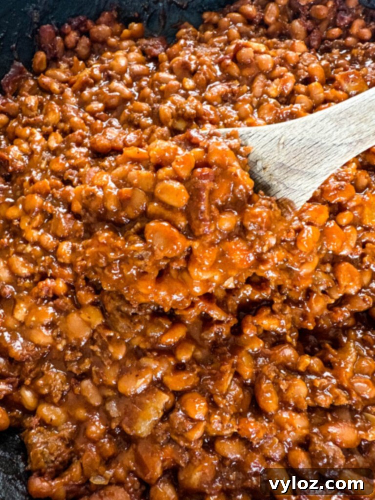 wooden spoonful of smoked baked beans