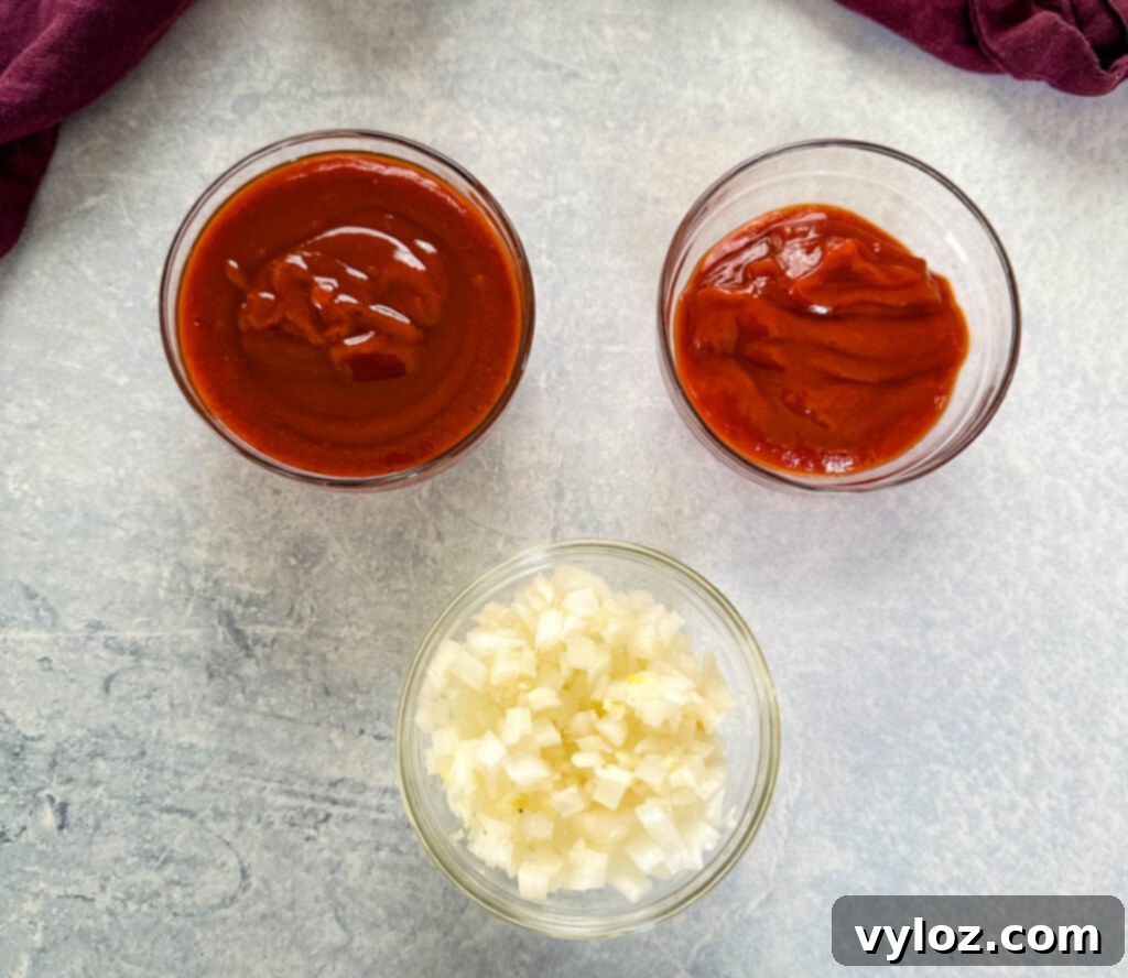 bbq sauce, ketchup, and chopped white onions in separate bowls