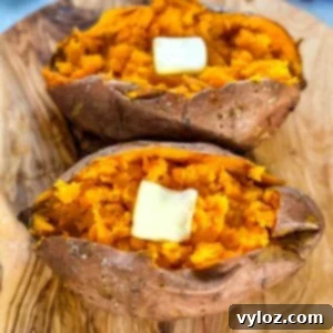 Smoked sweet potatoes in butter on a flat surface, ready to be served.