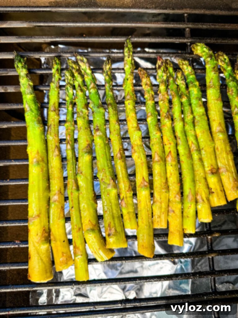 Wood-Kissed Asparagus 7 asparagus on a smoker grill
