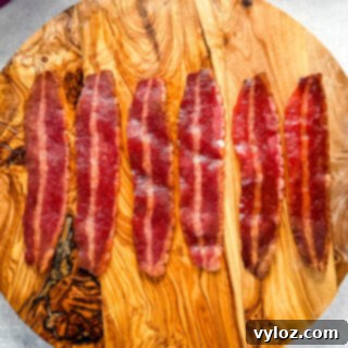 Air fryer turkey bacon on a flat surface, showcasing its crispy texture.