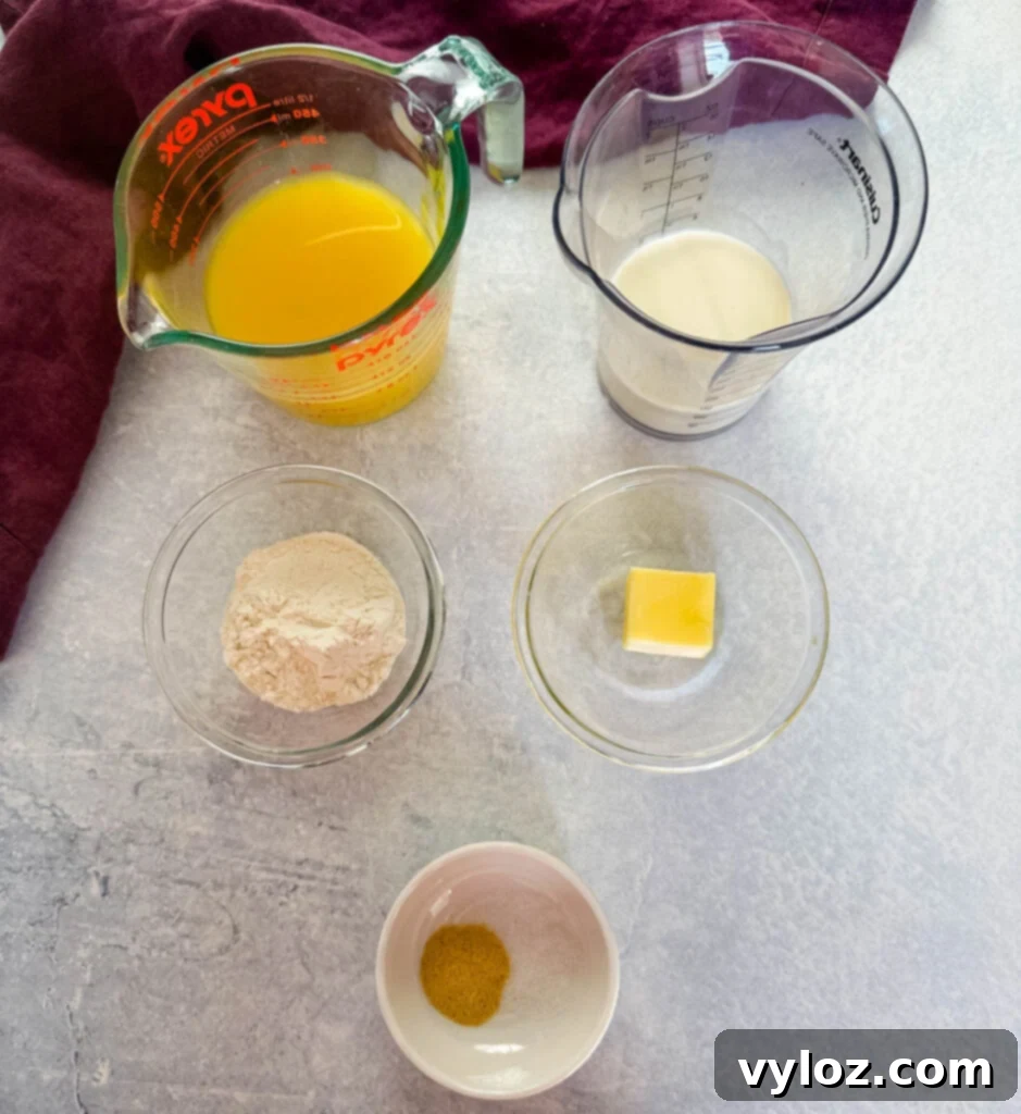 Savory Slow-Cooked Potatoes and Onions 8 Ingredients for homemade gravy: broth, heavy cream, flour, butter, and spices in separate bowls