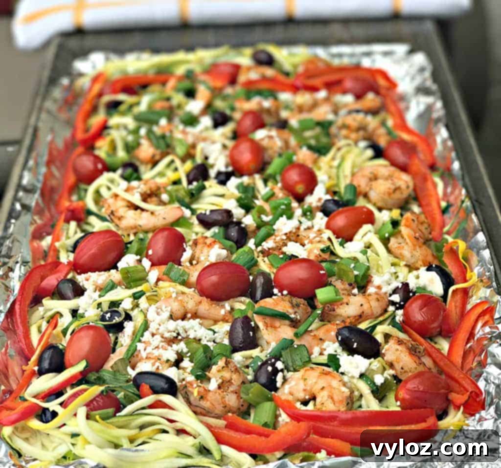 Sheet pan Mediterranean shrimp with zucchini noodles, fresh from the oven, showcasing colorful ingredients