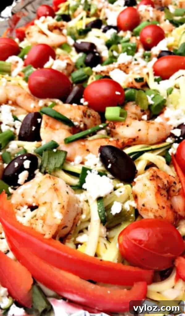 Close-up of Sheet-Pan Mediterranean Shrimp with Zucchini Noodles, highlighting the succulent shrimp and colorful vegetables