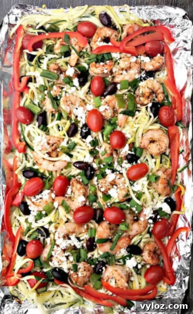 A serving of Sheet-Pan Mediterranean Shrimp with Zucchini Noodles on a plate, ready to be enjoyed