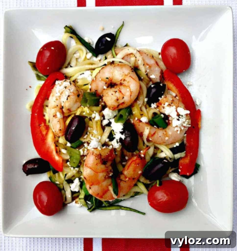 Freshly spiralized zucchini noodles in a bowl, showing their texture and readiness for cooking