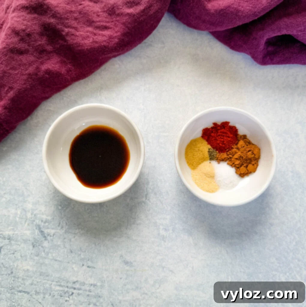 steak rub spices and soy sauce in separate white bowls