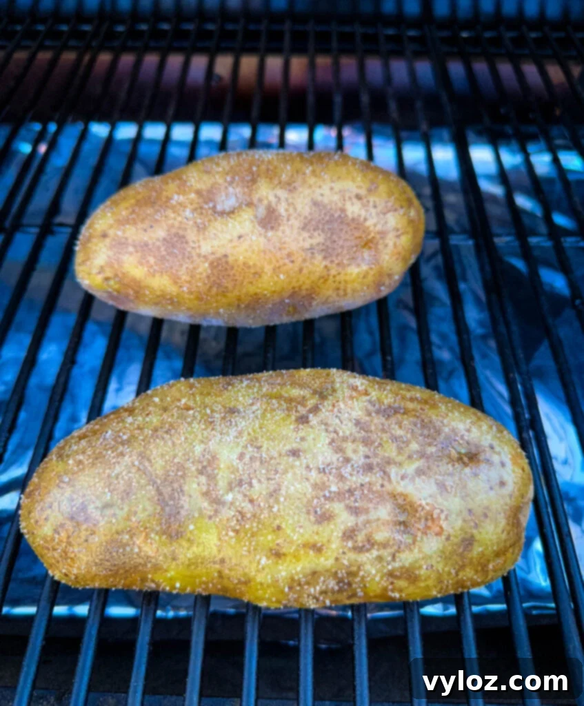 Traeger Smoked Baked Potatoes 4 russet potatoes on a Traeger pellet grill