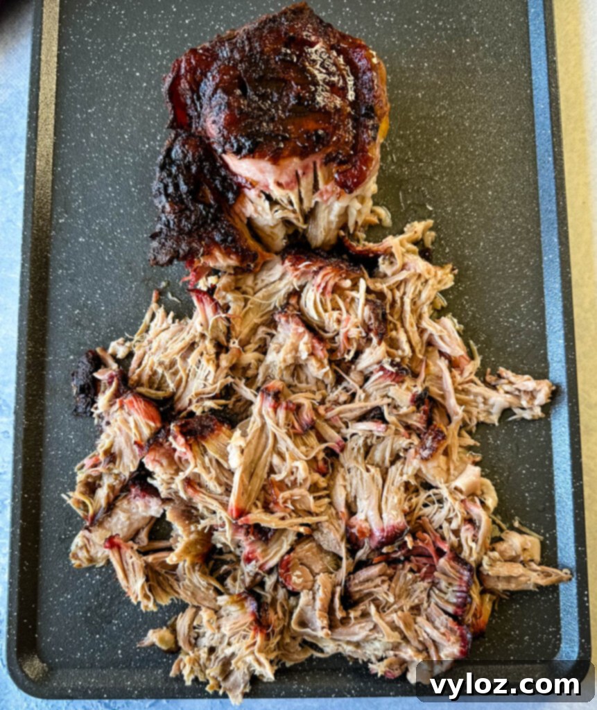 smoked pulled pork and pork shoulder on a sheet pan