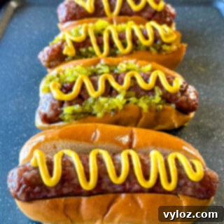 The Perfect Traeger Smoked Brats 11 smoked brats on buns with mustard and relish