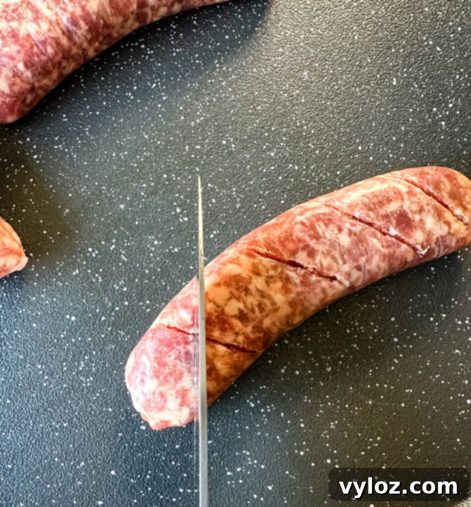 The Perfect Traeger Smoked Brats 5 brat scored on a sheet pan