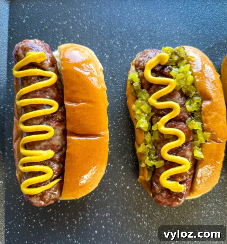 The Perfect Traeger Smoked Brats 9 smoked brats on buns with mustard and relish