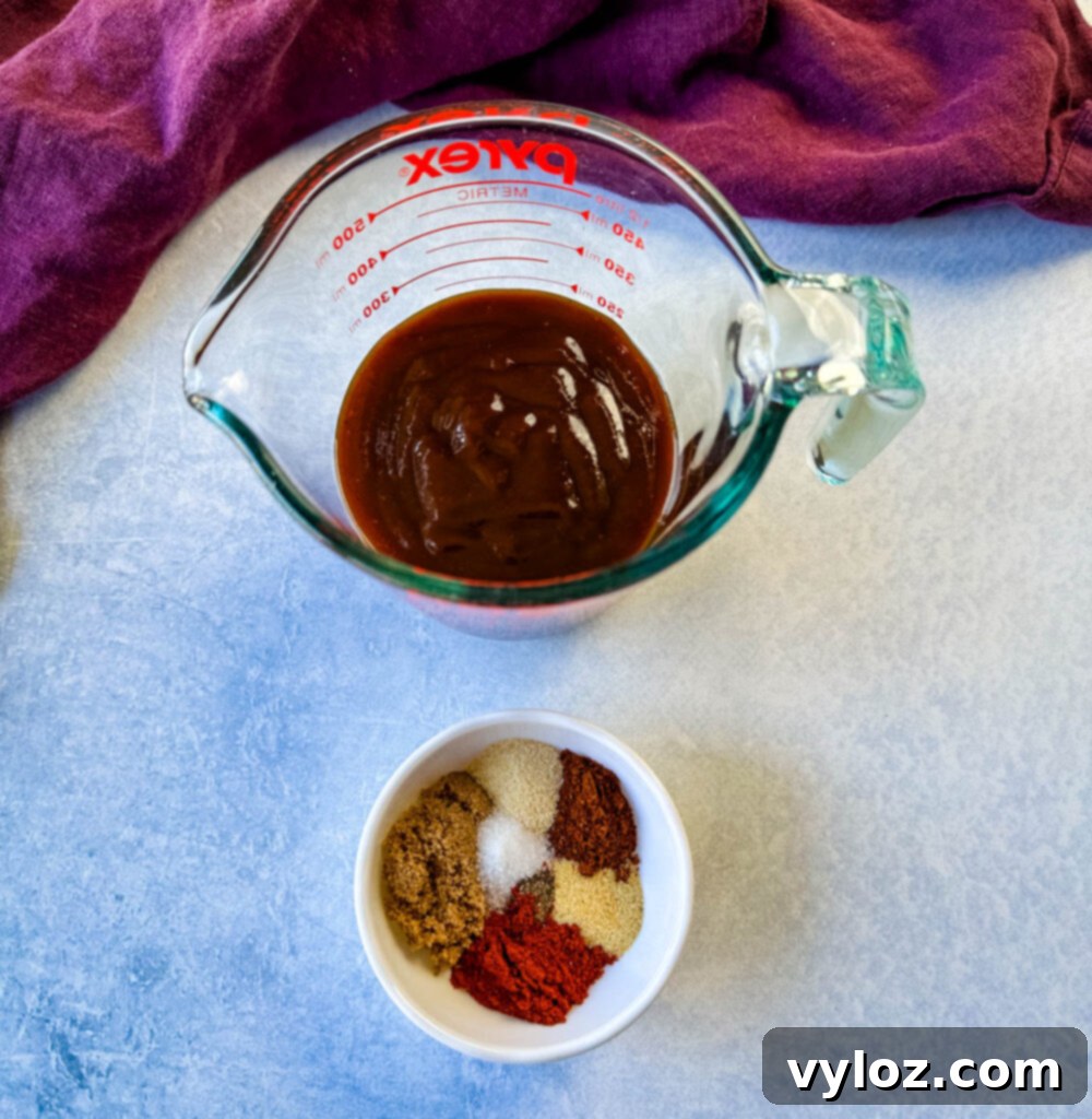Slow Cooker BBQ Spare Ribs 5 Homemade BBQ rub and a bowl of rich BBQ sauce side-by-side, ready for seasoning and glazing ribs