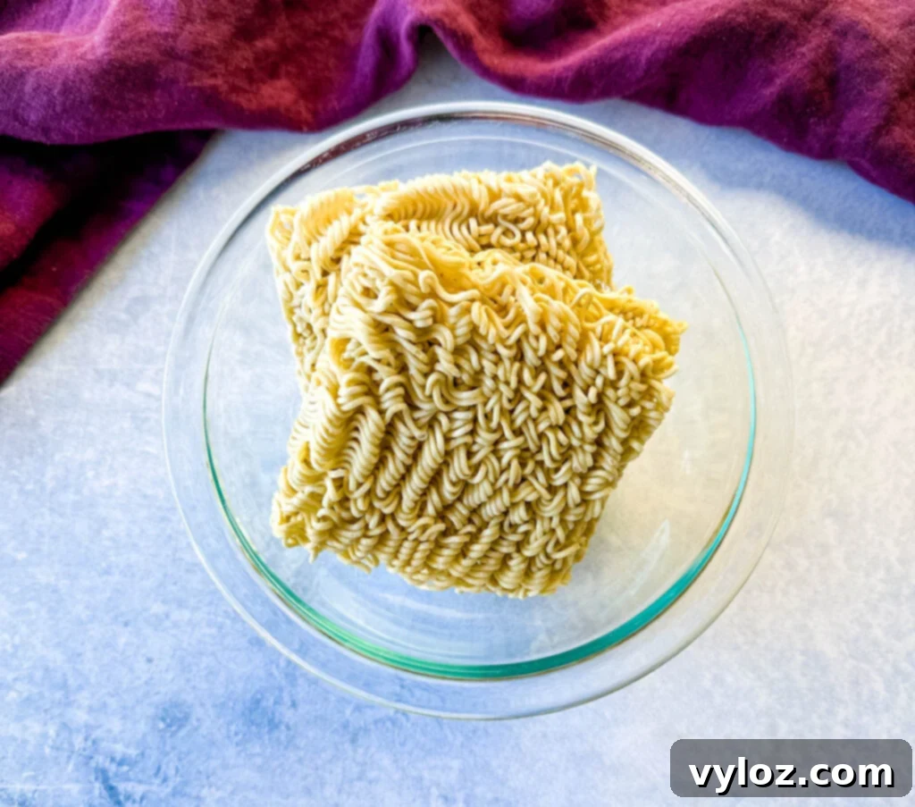 Umami Pork Belly Ramen 6 dry ramen noodles in a glass bowl