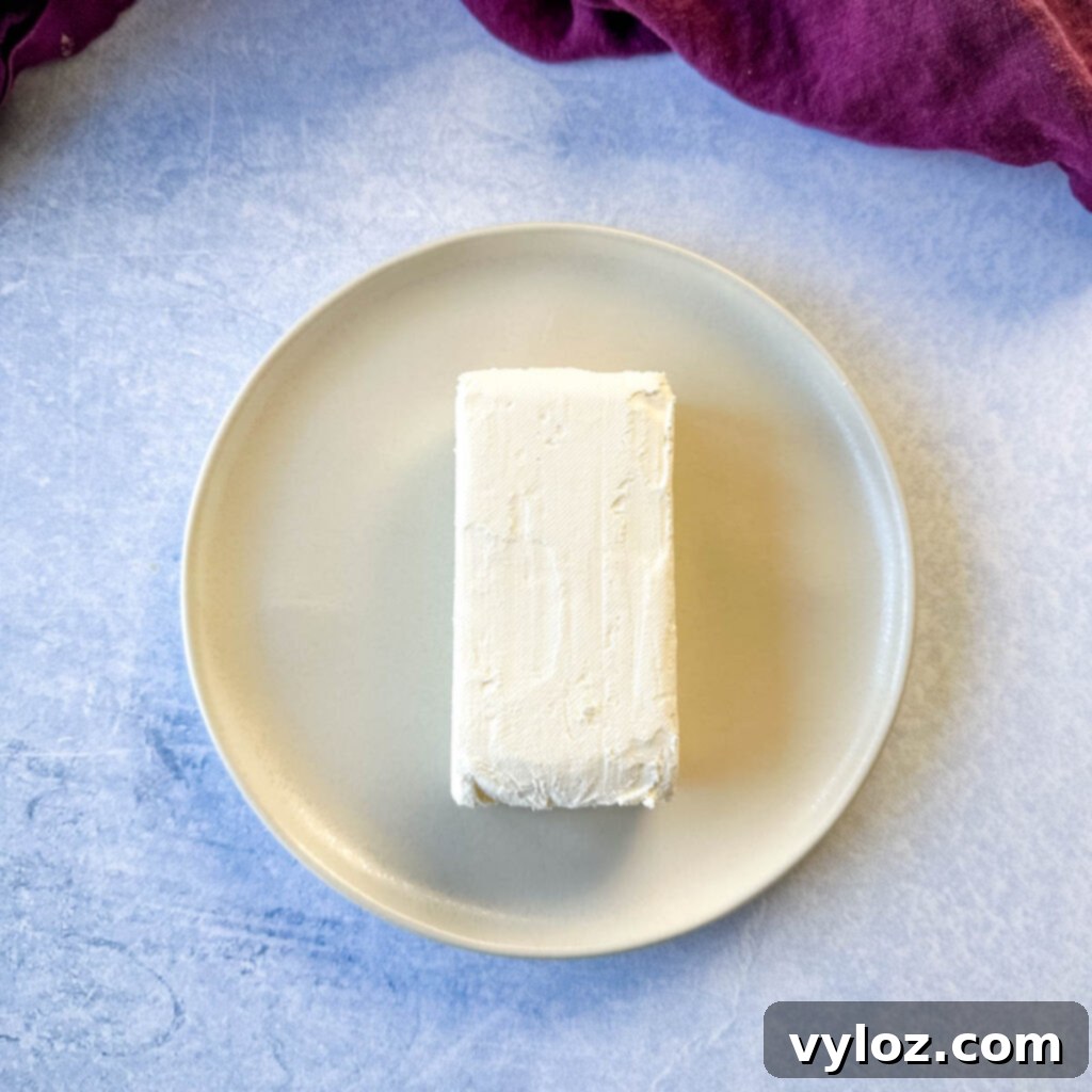 8oz block of cream cheese on a plate