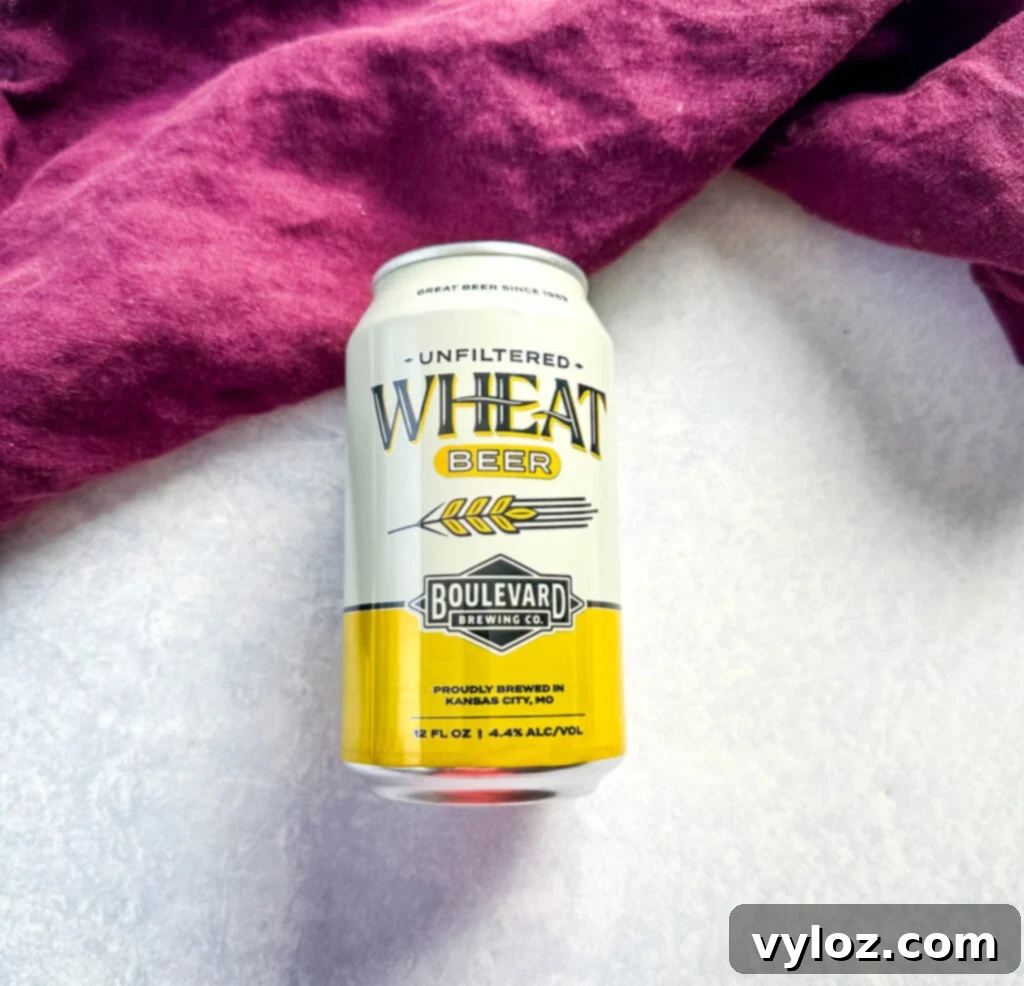 Smoked Beer Can Chicken Perfection 3 can of unopened beer on a flat surface