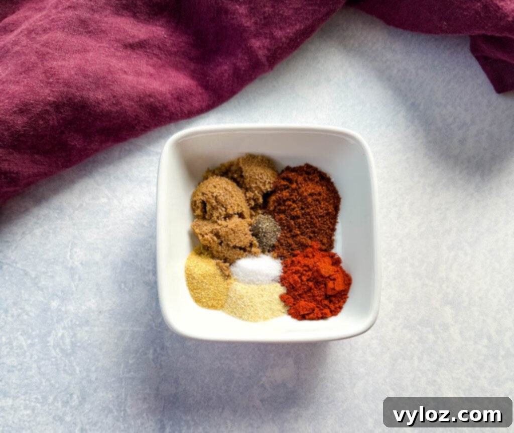 Smoked Beer Can Chicken Perfection 4 homemade dry rub for chicken spices in a white bowl