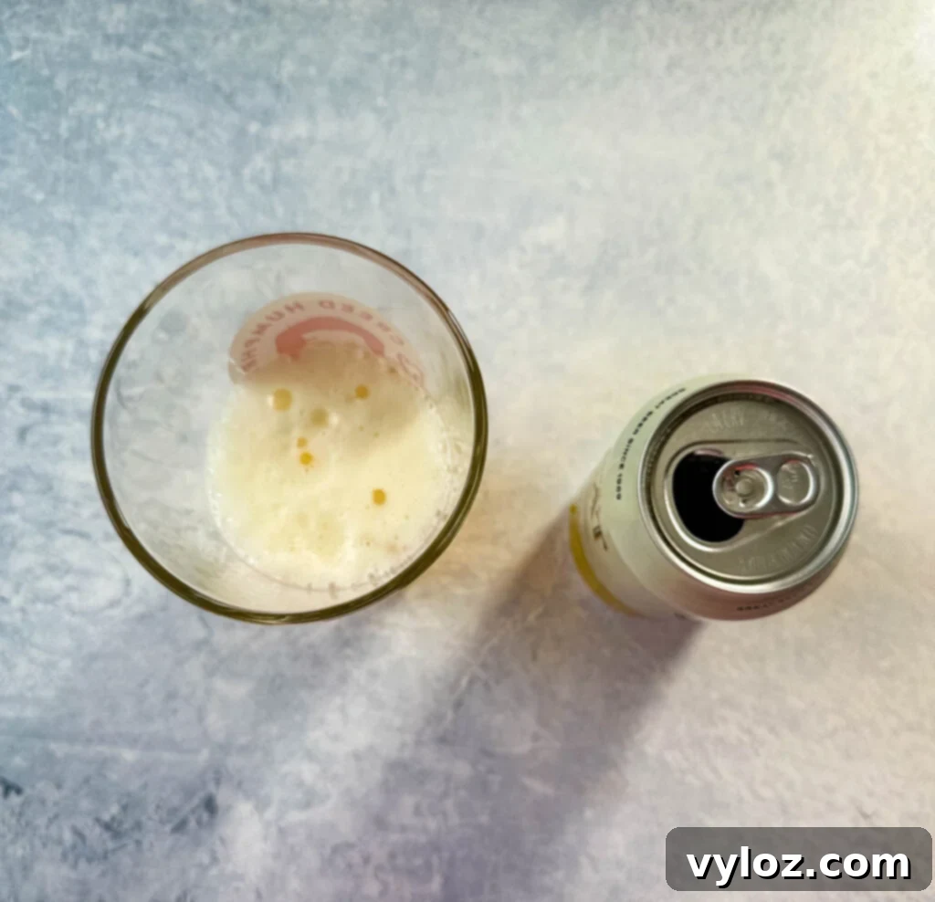 Smoked Beer Can Chicken Perfection 5 an open can of beer and a half glass of beer