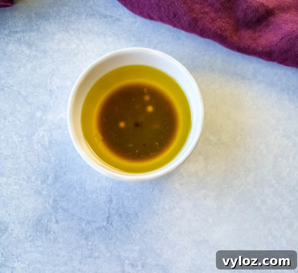 Vibrant Watermelon Feta Salad with Balsamic 5 olive oil, balsamic vinegar, and lime juice in a white bowl