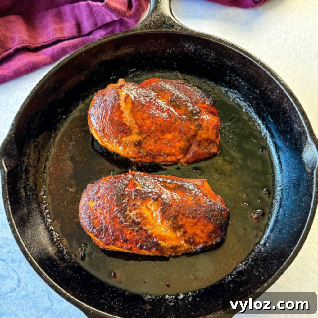Blackened Chicken 8 cooked blackened chicken breasts in a cast iron skillet