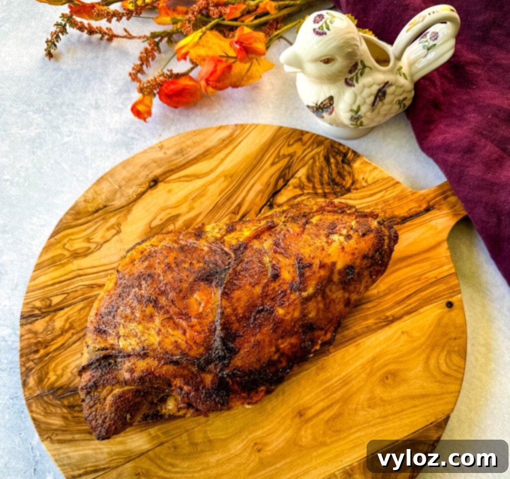 Juicy Bone-In Turkey Breast 9 baked roasted bone in turkey breast on a wooden cutting board