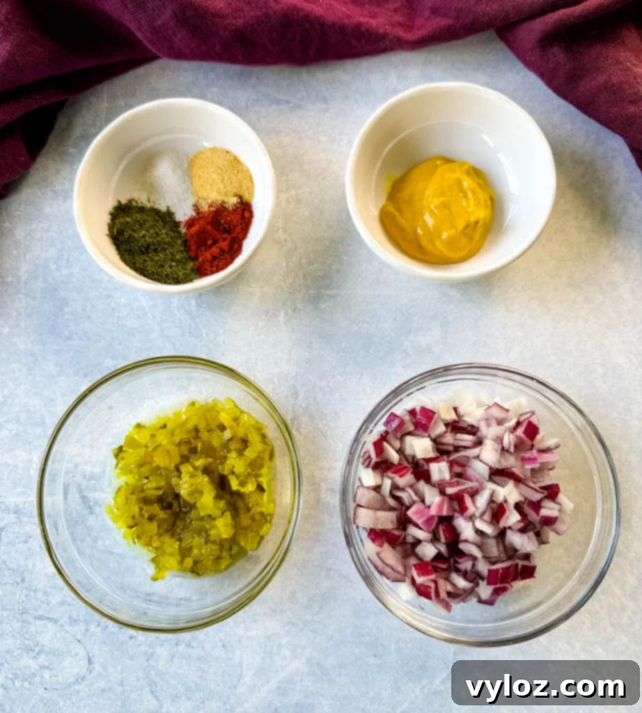 ranch seasoning, paprika, mustard, relish, and onions in separate white bowls