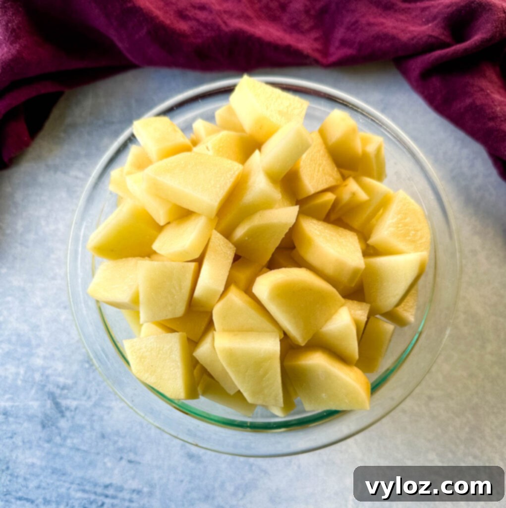 raw diced potatoes in a glass bowl