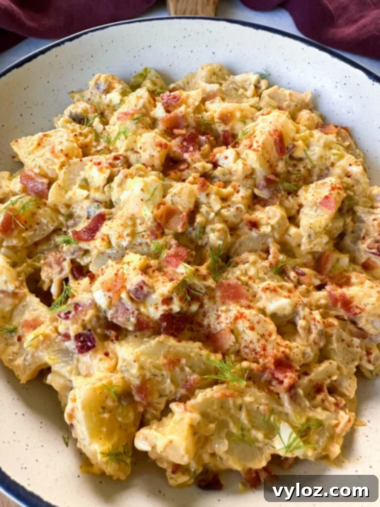 bacon ranch potato salad in a white bowl