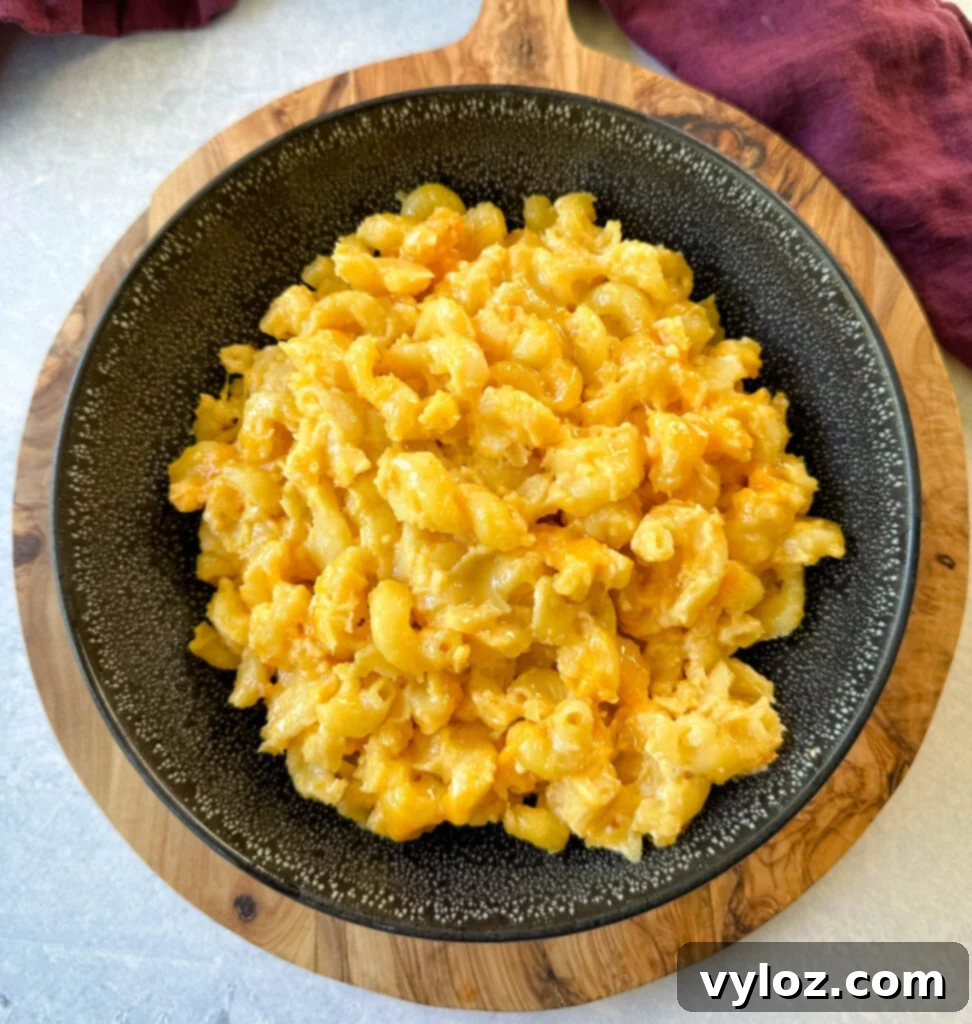 Effortless Crockpot Mac and Cheese 12 slow cooker Crockpot mac and cheese in a black bowl