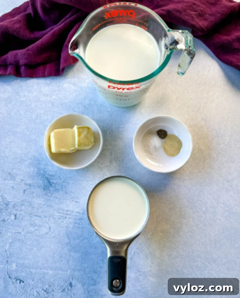 Effortless Crockpot Mac and Cheese 3 milk, butter, garlic powder, salt, pepper, and heavy whipping cream in separate bowls