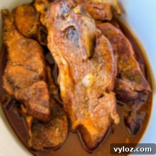 country style ribs with BBQ sauce in a slow cooker Crockpot