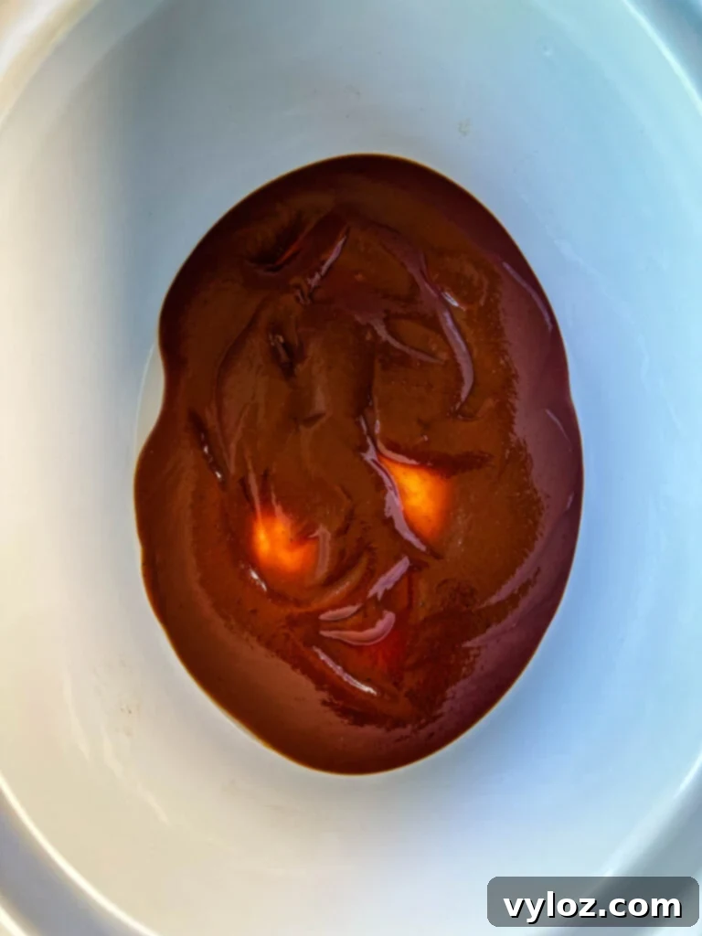 BBQ sauce in a white slow cooker Crockpot