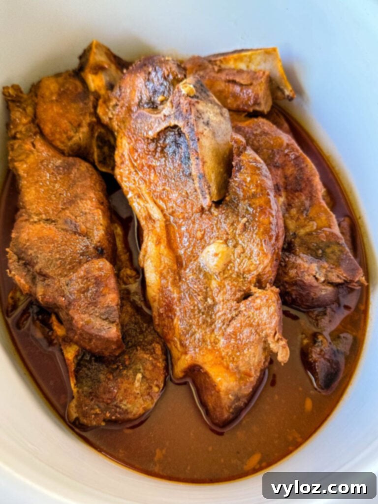 country style ribs with BBQ sauce in a slow cooker Crockpot