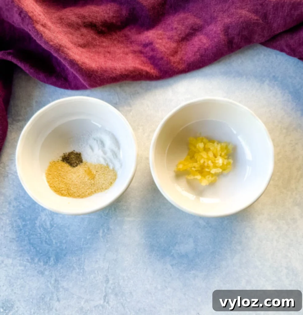 minced garlic and spices in separate white bowls