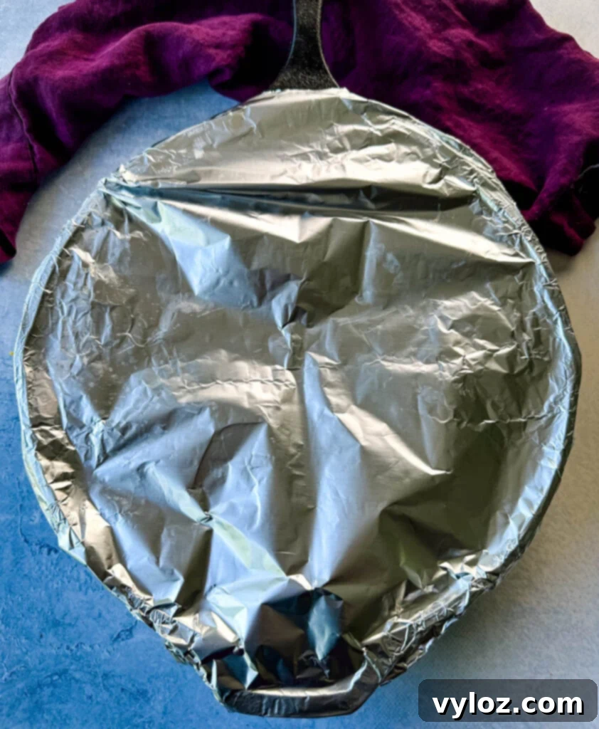 Decadent Bacon and Cheese Potato Gratin 10 cast iron skillet covered in foil