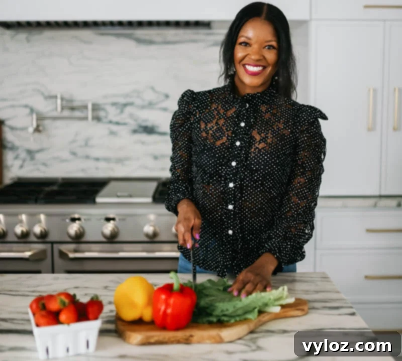 Golden Sweet Potato Pecan Delight 3 Brandi Crawford, a chef, smiling in her kitchen.
